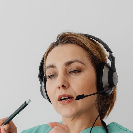 An interpreter wearing a headset on a call