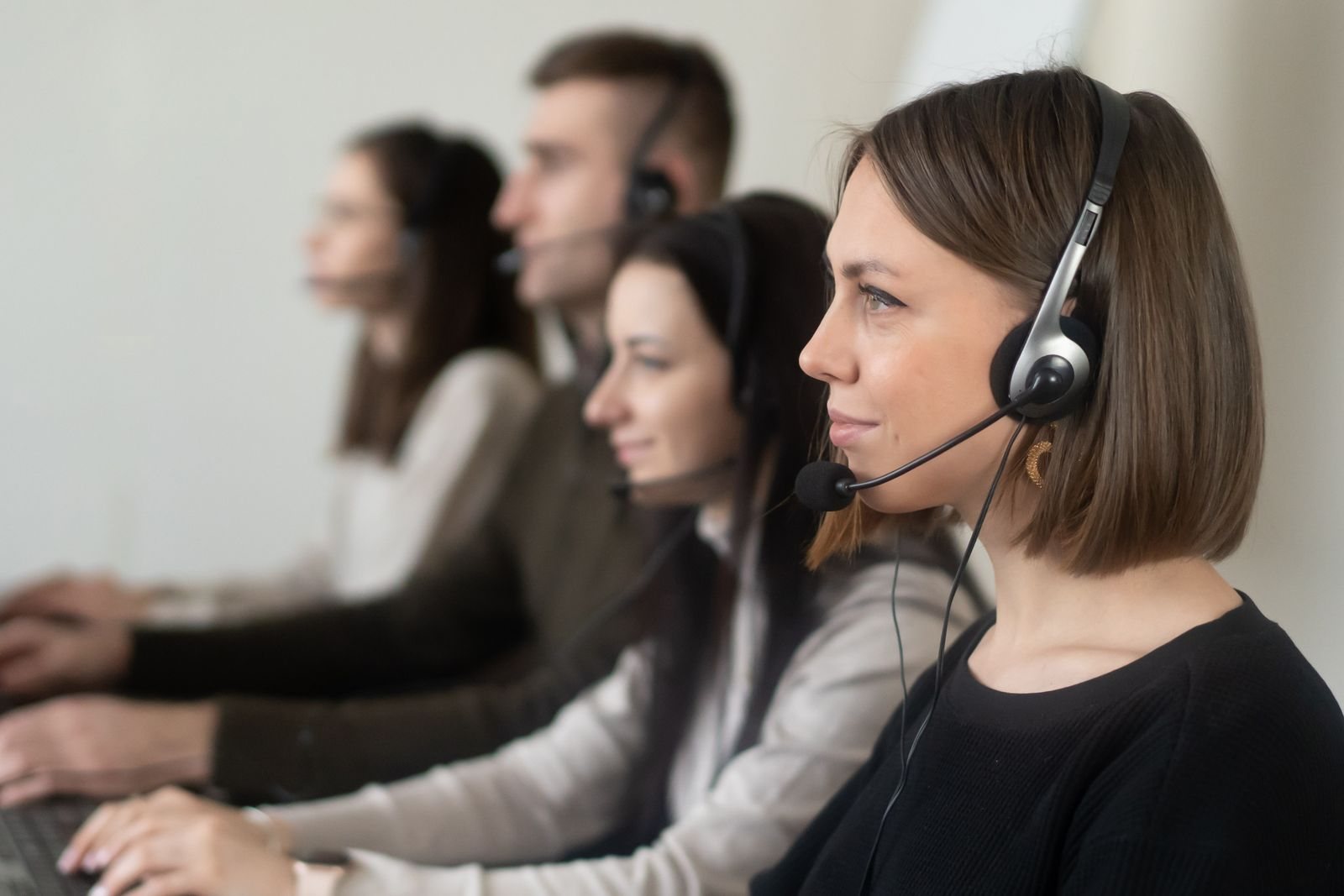 Multilingual customer experience agents at their workstations