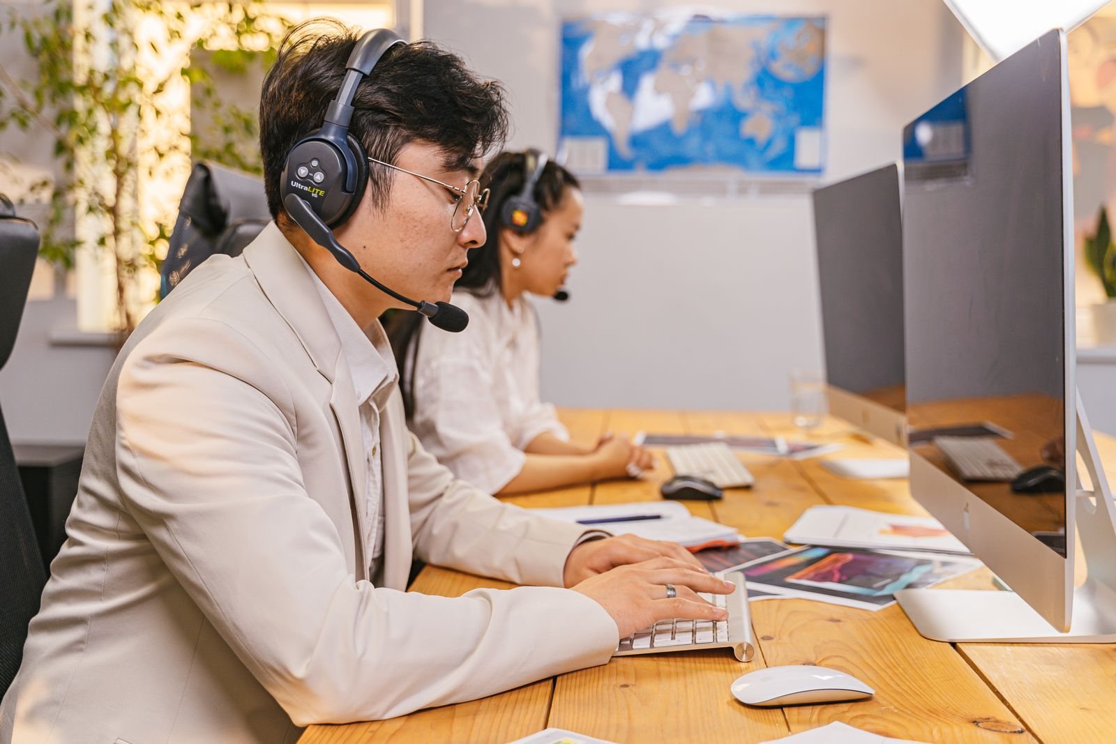 An interpreter with a headset at his workstation