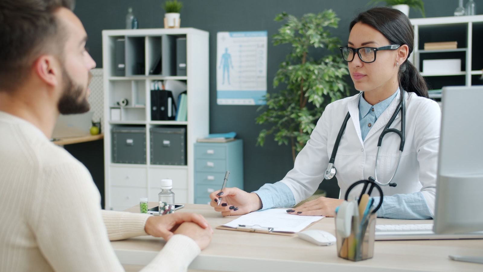 A physician in consultation with a patient