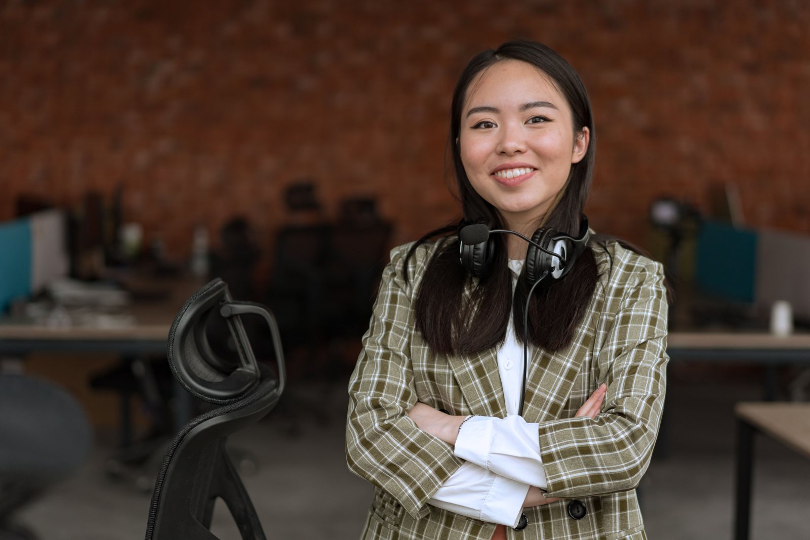 A language specialist with her headset around her neck